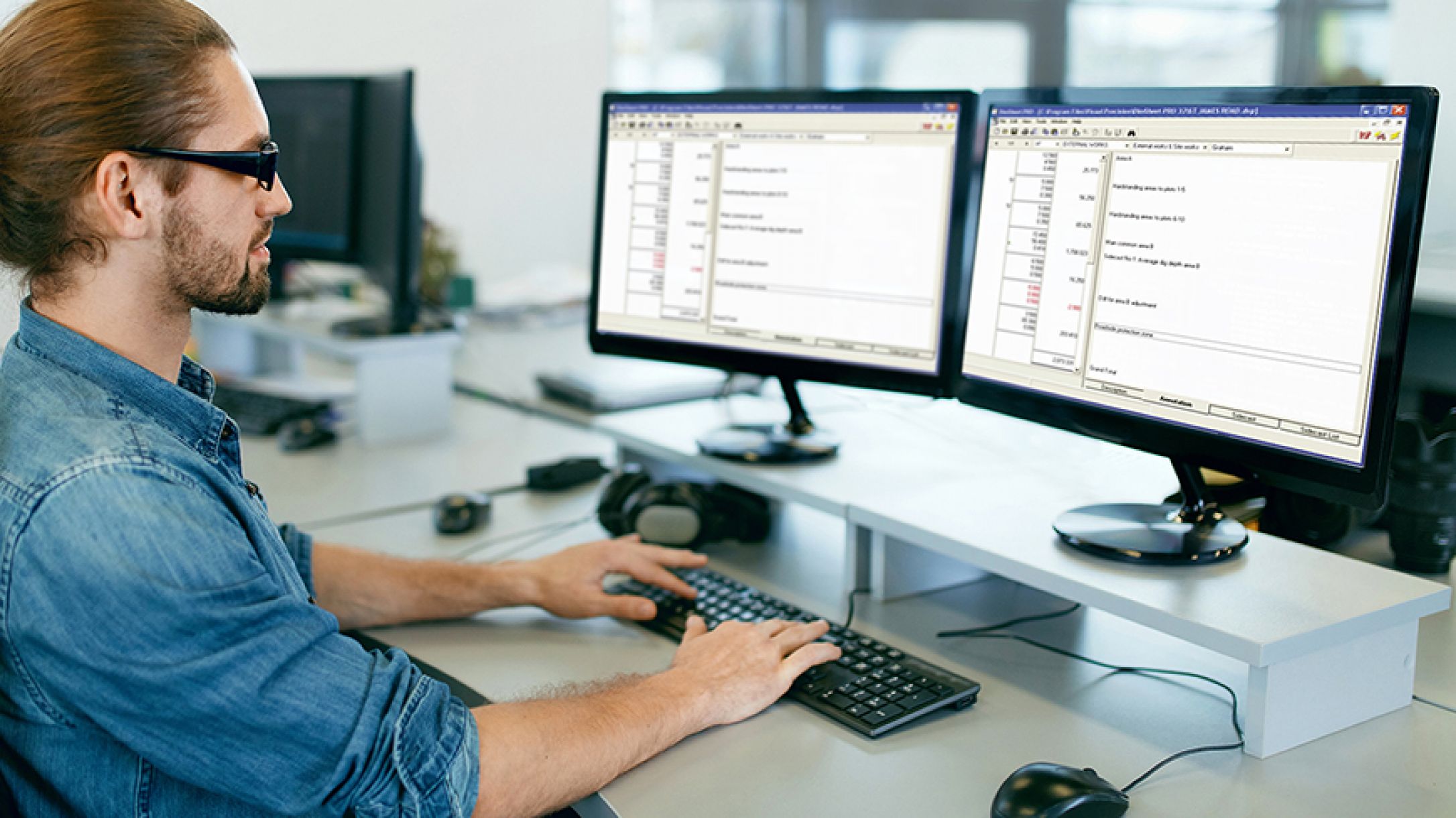 man using dimsheet-pro on twin screens